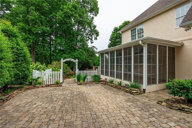 608 Greyrock Rd, Whitsett, NC 27377 - view of patio featuring a sunroom