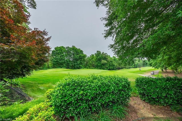 608 Greyrock Rd, Whitsett, NC 27377 - view of home's community with view of golf course and a yard