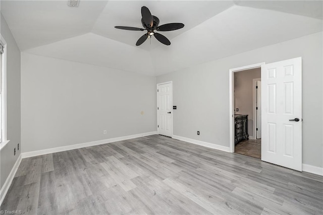 unfurnished bedroom featuring ceiling fan, light hardwood / wood-style flooring, and lofted ceiling