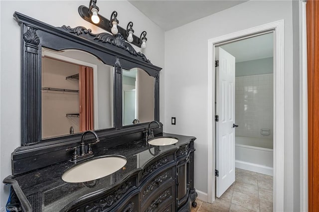 bathroom with tile patterned floors and vanity