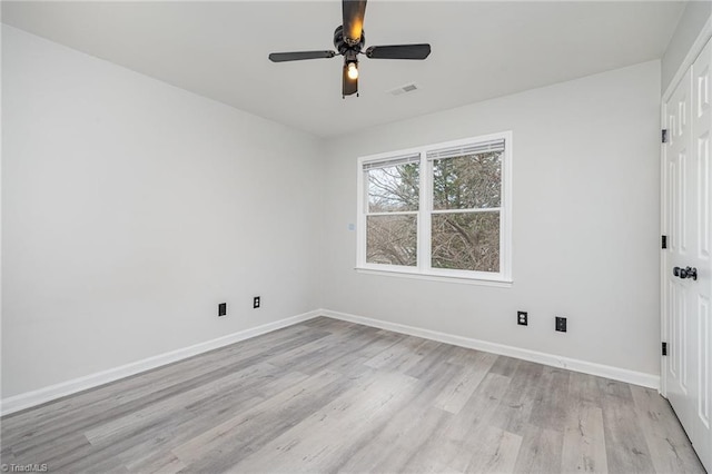 unfurnished room featuring ceiling fan and light hardwood / wood-style floors