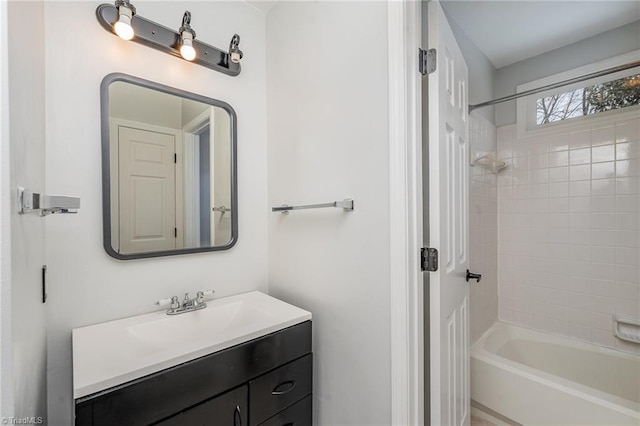 bathroom featuring vanity and tiled shower / bath combo