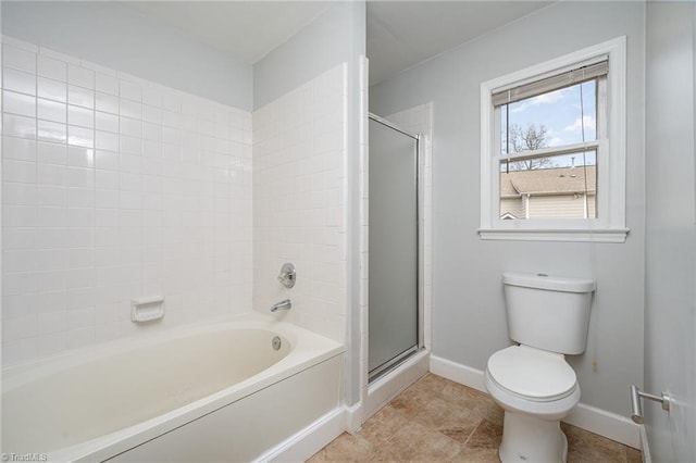 bathroom featuring toilet and shower with separate bathtub