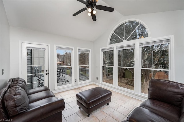 tiled living room with ceiling fan and vaulted ceiling