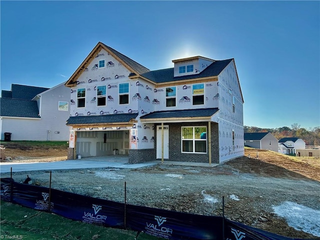 unfinished property with a garage