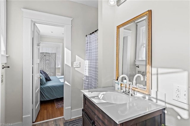 bathroom featuring hardwood / wood-style floors and vanity