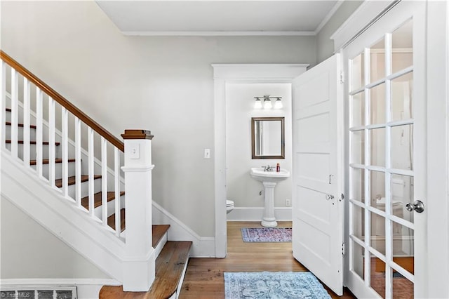 stairs featuring wood-type flooring