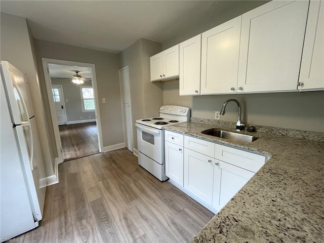 kitchen featuring white appliances, light wood-type flooring, ceiling fan, sink, and white cabinetry