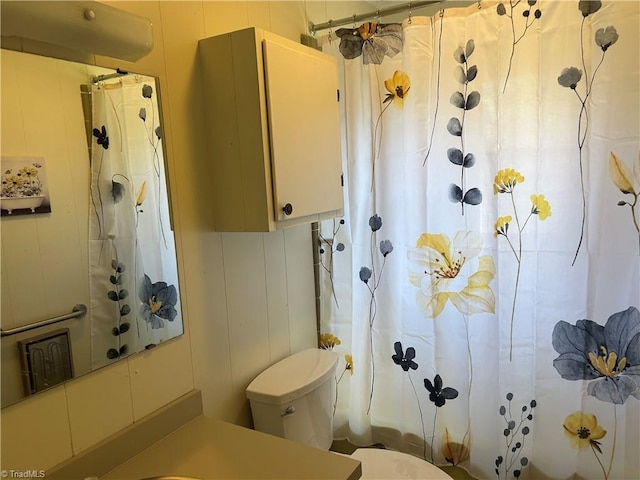 bathroom with toilet and shower / tub combo with curtain