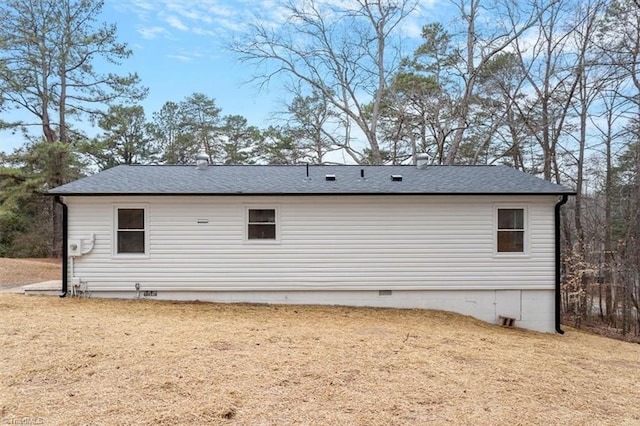 view of property exterior with a yard