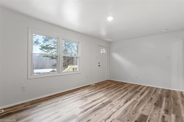 empty room with light wood-type flooring