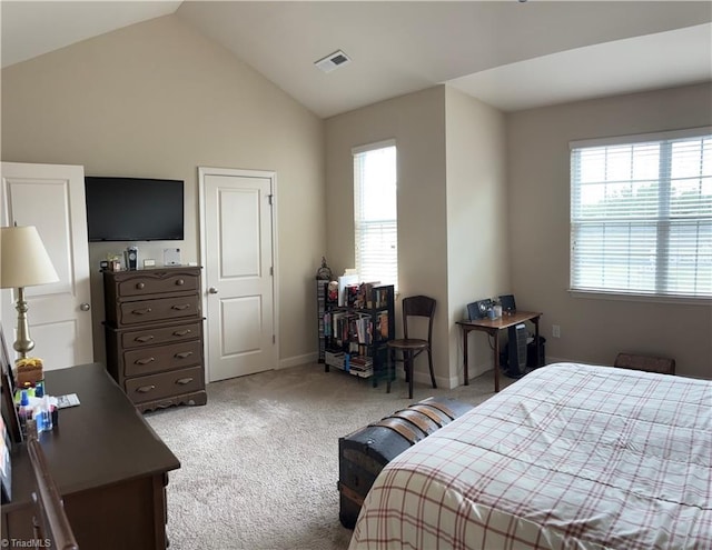 carpeted bedroom with lofted ceiling, visible vents, and baseboards