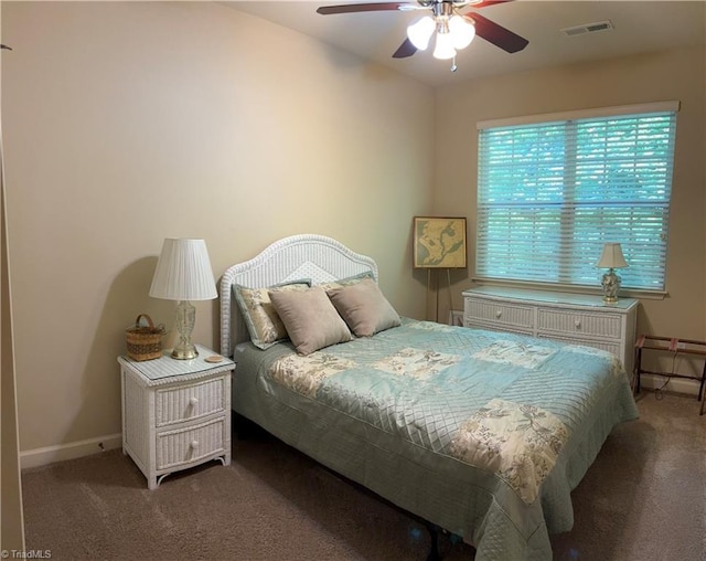 bedroom featuring ceiling fan, carpet floors, visible vents, and baseboards