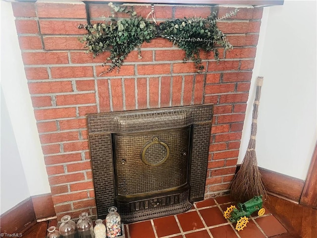 room details featuring a brick fireplace