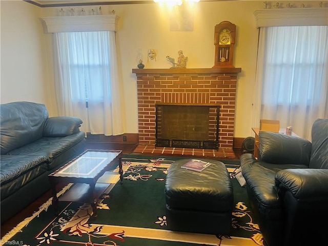 living room with a brick fireplace