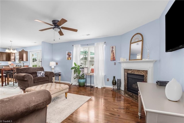 4385 Morning Ridge Ln, Winston-Salem, NC 27101 - living area with healthy amount of natural light, ceiling fan, dark wood-type flooring, and a high end fireplace