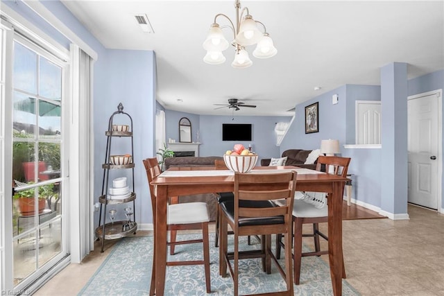 4385 Morning Ridge Ln, Winston-Salem, NC 27101 - dining area with a chandelier and a ceiling fan