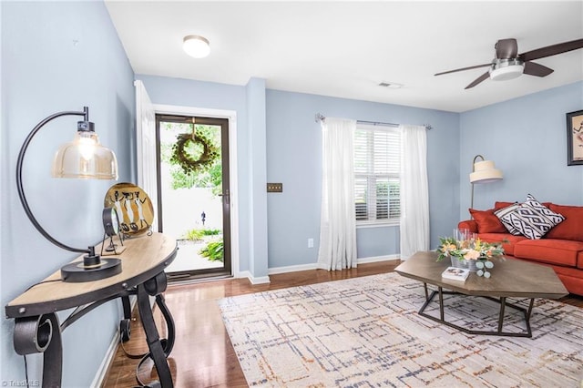 4385 Morning Ridge Ln, Winston-Salem, NC 27101 - living room with wood finished floors, plenty of natural light, and a ceiling fan