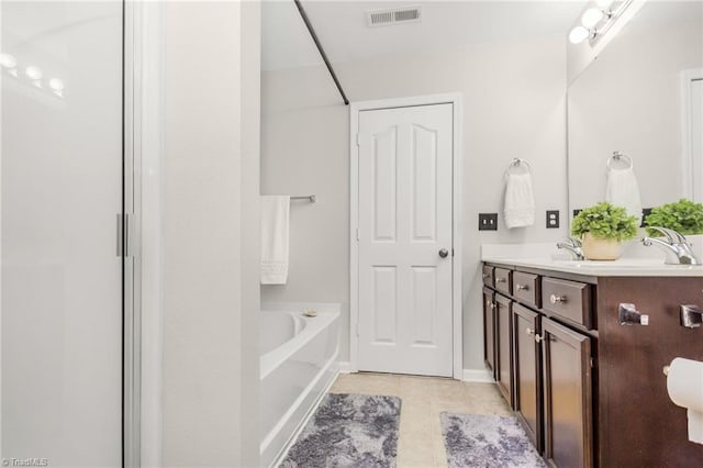 4385 Morning Ridge Ln, Winston-Salem, NC 27101 - bathroom featuring tile patterned flooring, double vanity, a tub to relax in, and a shower
