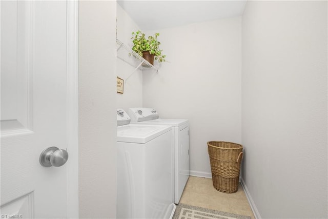 4385 Morning Ridge Ln, Winston-Salem, NC 27101 - laundry area with washing machine and clothes dryer and light tile patterned flooring