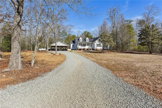 view of front of home featuring a porch and a carport