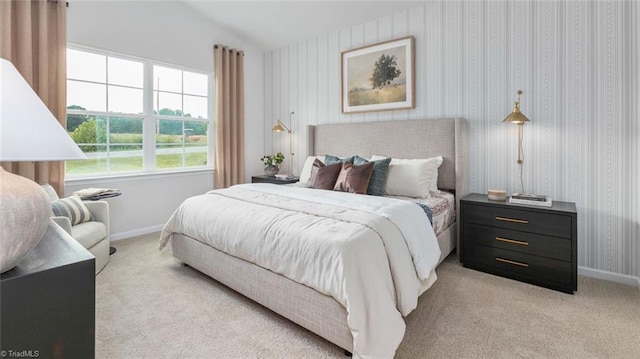 carpeted bedroom featuring lofted ceiling