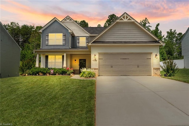 1951 Rubywood St, Greensboro, NC 27405 - craftsman house featuring brick siding, driveway, a front lawn, and a garage