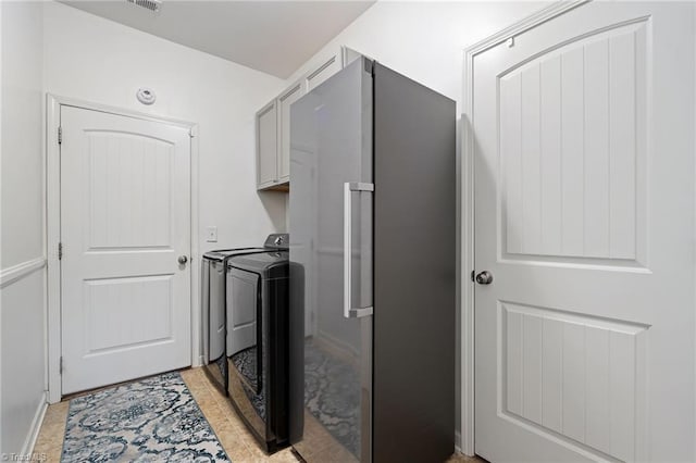 1951 Rubywood St, Greensboro, NC 27405 - washroom featuring washing machine and clothes dryer and cabinet space