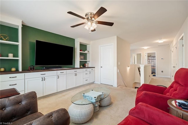 1951 Rubywood St, Greensboro, NC 27405 - living area featuring light carpet, a ceiling fan, and built in features