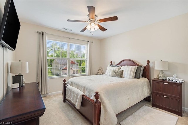 1951 Rubywood St, Greensboro, NC 27405 - bedroom with light carpet and a ceiling fan