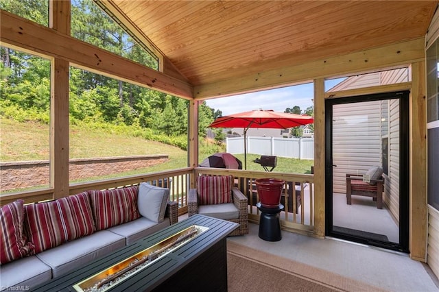 1951 Rubywood St, Greensboro, NC 27405 - sunroom / solarium featuring an outdoor hangout area, lofted ceiling, and healthy amount of natural light