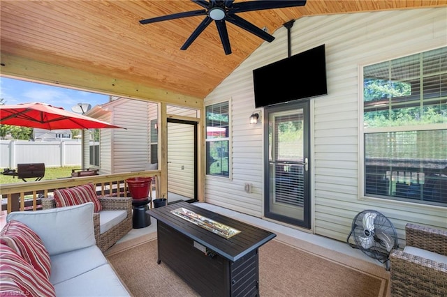 1951 Rubywood St, Greensboro, NC 27405 - wooden deck with an outdoor living space with a fire pit and a ceiling fan