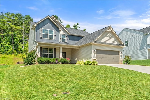 1951 Rubywood St, Greensboro, NC 27405 - craftsman house featuring board and batten siding, concrete driveway, an attached garage, and a front yard