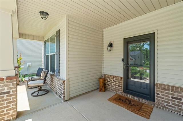 1951 Rubywood St, Greensboro, NC 27405 - view of exterior entry featuring a porch and brick siding