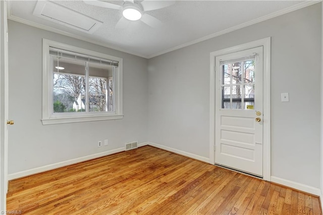 interior space featuring light hardwood / wood-style floors, plenty of natural light, crown molding, and ceiling fan