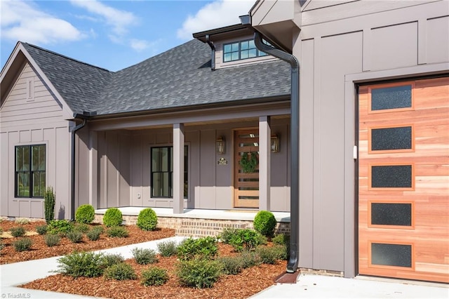 view of exterior entry with covered porch