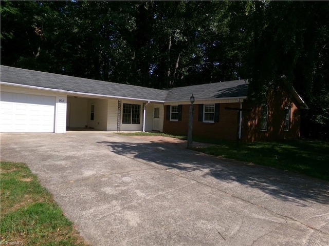 203 Turkey Hill Dr, King, NC 27021 - single story home with driveway, a carport, and a front yard