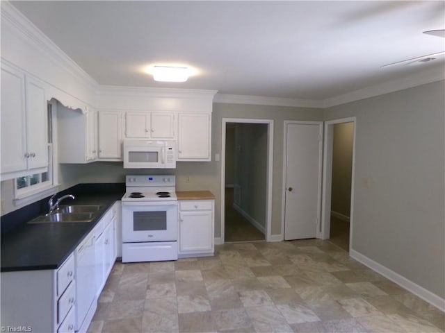 203 Turkey Hill Dr, King, NC 27021 - kitchen with white appliances, white cabinets, dark countertops, and ornamental molding