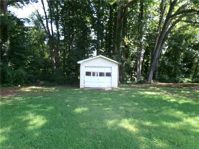203 Turkey Hill Dr, King, NC 27021 - view of green lawn with an outdoor structure and a detached garage