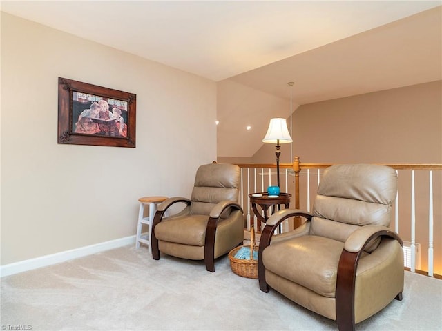 living area with light colored carpet and vaulted ceiling