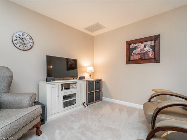 living area with light colored carpet