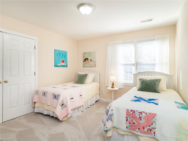 bedroom with light colored carpet