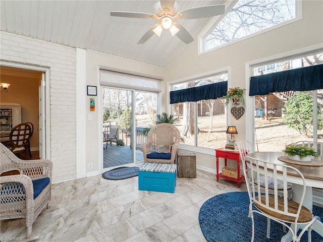 sunroom / solarium featuring lofted ceiling, wooden ceiling, and ceiling fan