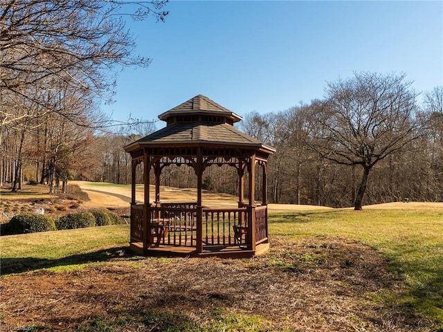 surrounding community with a gazebo and a lawn