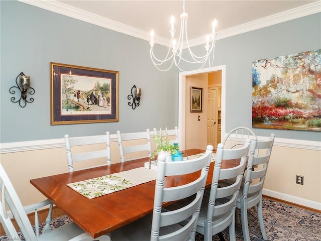 dining room featuring crown molding, a notable chandelier, and hardwood / wood-style flooring