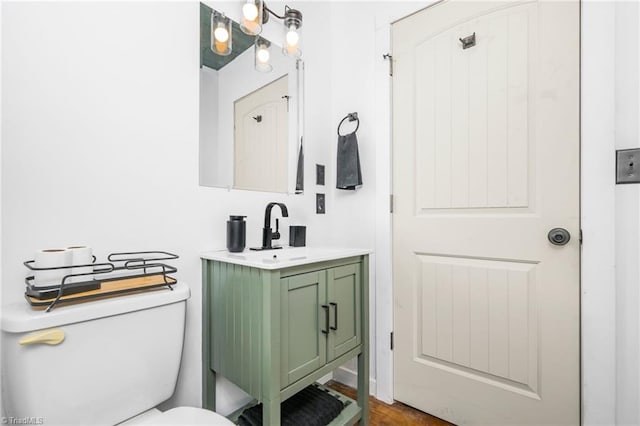 half bath with vanity and toilet