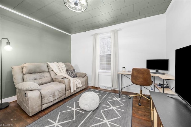 office space with baseboards and dark wood-type flooring