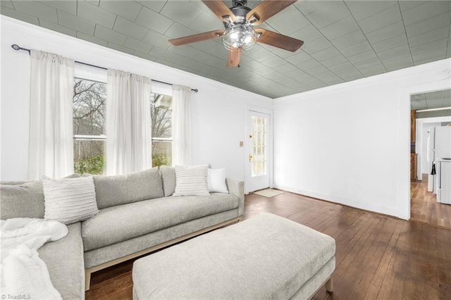 living room with ceiling fan, wood finished floors, and crown molding