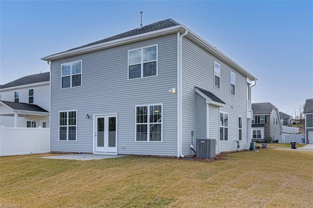 back of property featuring a patio area, a yard, fence, and central air condition unit