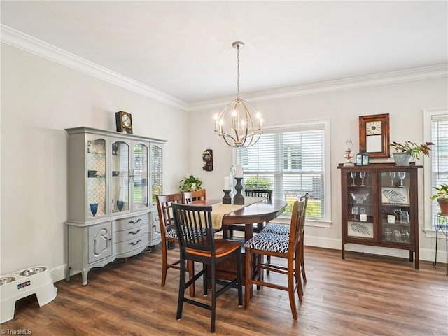 1659 Angus Ridge Dr, Kernersville, NC 27284 - dining space featuring ornamental molding, a chandelier, dark wood-type flooring, healthy amount of natural light, and baseboards